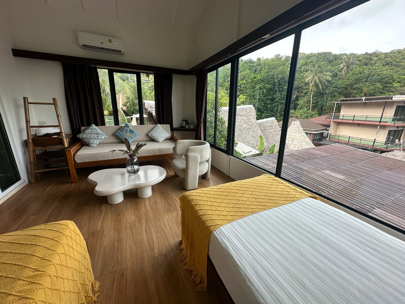 A Phi Phi sitting area after processing, warmer floor and shadow lifted.